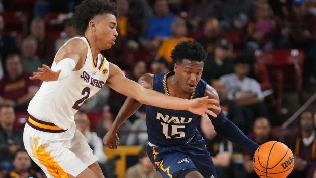 Nov 10, 2022; Tempe, Arizona, USA; ASU Sun Devils guard Austin Nunez (2) defends NAU Lumberjacks guard Jalen Cone (15) at Desert Financial Arena. Mandatory Credit: Joe Rondone-Arizona Republic Basketball Asu Mbb